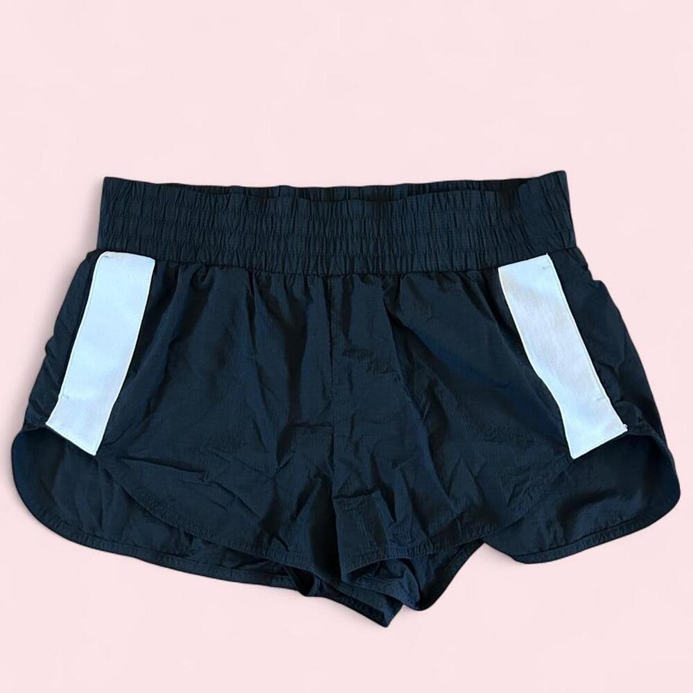 Black Windbreaker athletic shorts with white side panels and pockets